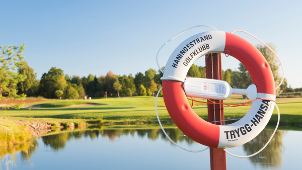 HaningeStrand Golfklubb logotyp